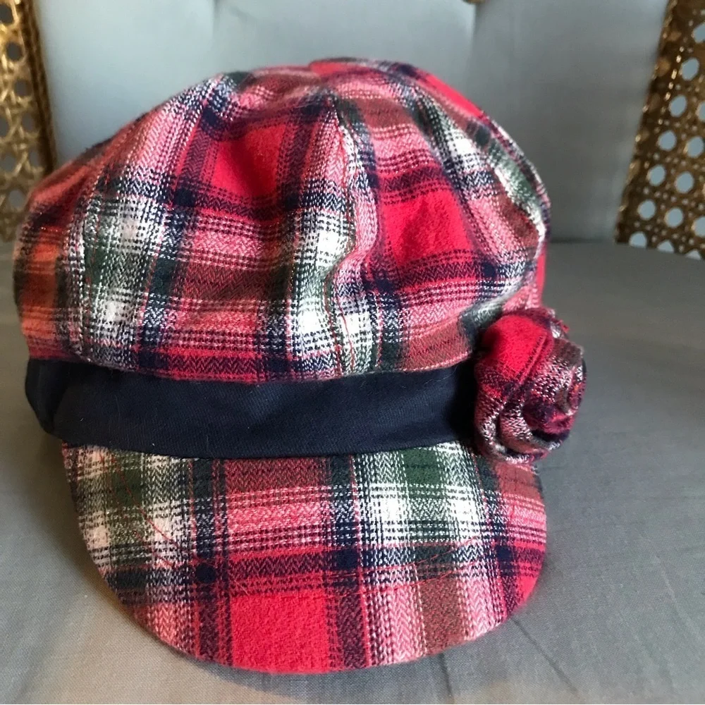 Justice plaid girls hat, Navy blue with reddish, green, silver, rosette in front